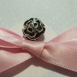 Authentic Pandora flower charm with pink CZ.